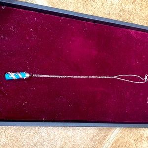 dragon wrapped around aquamarine necklace